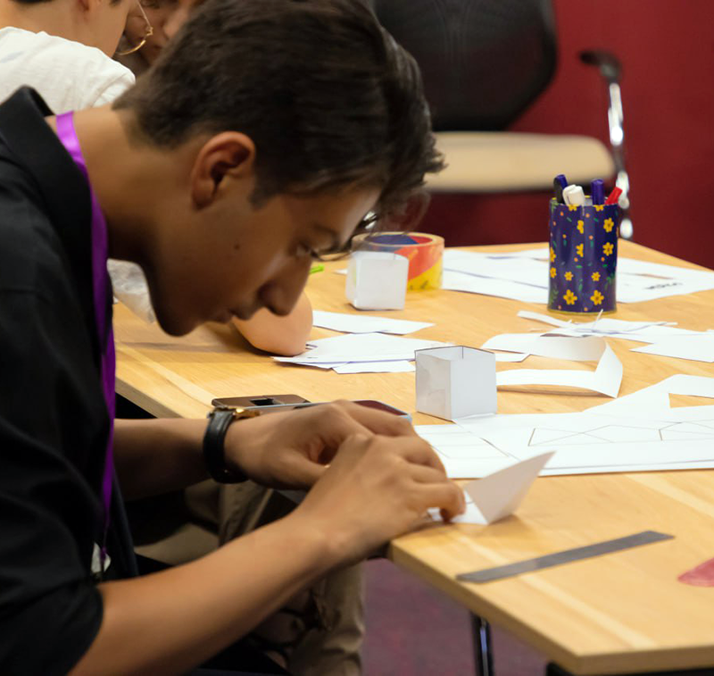 Student is building an origami